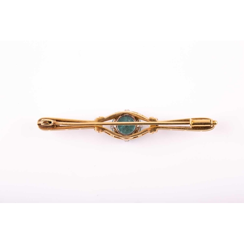 104 - A white and yellow gold and blue zircon brooch, set with a mixed round-cut zircon measuring approxim... 