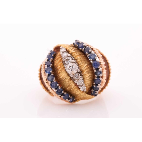 106 - A vintage sapphire and diamond dress ring - circa 1960; comprising rows of circular cut sapphires an... 