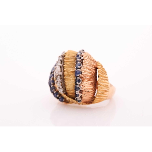 106 - A vintage sapphire and diamond dress ring - circa 1960; comprising rows of circular cut sapphires an... 