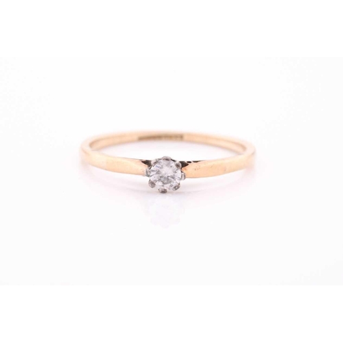 107 - A single stone synhetic corundum dress ring; the circular cut stone in six claw setting and heart-sh... 
