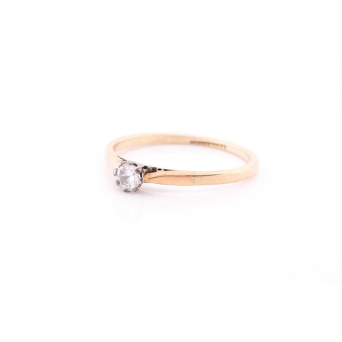 107 - A single stone synhetic corundum dress ring; the circular cut stone in six claw setting and heart-sh... 