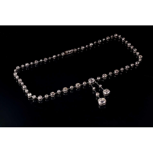 110 - An impressive antique collet-set diamond lavliere necklace, suspended with two old mine cut diamonds... 