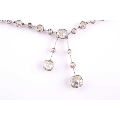 110 - An impressive antique collet-set diamond lavliere necklace, suspended with two old mine cut diamonds... 