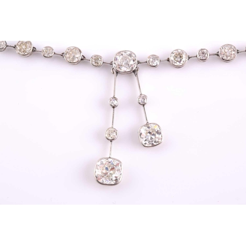 110 - An impressive antique collet-set diamond lavliere necklace, suspended with two old mine cut diamonds... 