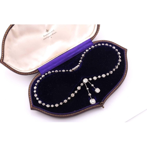 110 - An impressive antique collet-set diamond lavliere necklace, suspended with two old mine cut diamonds... 