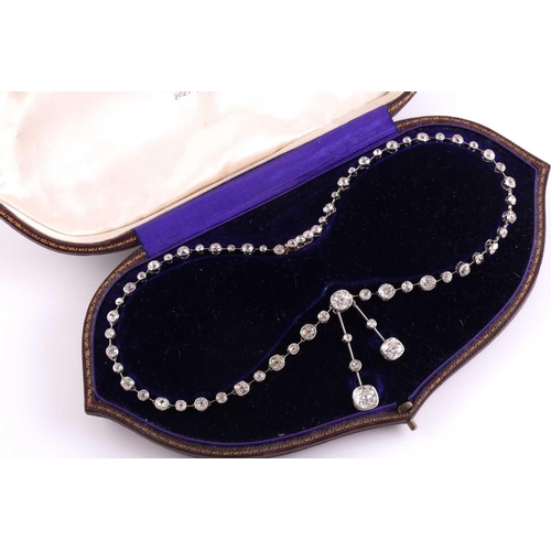 110 - An impressive antique collet-set diamond lavliere necklace, suspended with two old mine cut diamonds... 