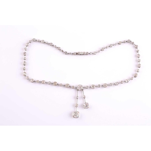 110 - An impressive antique collet-set diamond lavliere necklace, suspended with two old mine cut diamonds... 