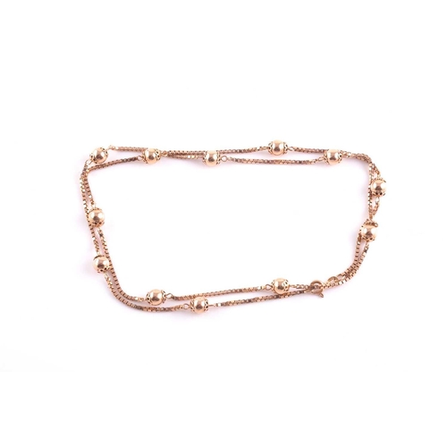 112 - A 9ct rose gold box-link and orb bead chain, makers mark Balestra to clasp, approximately 60 cm long... 