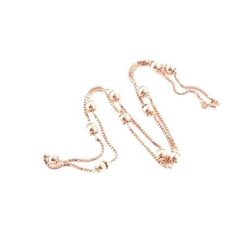112 - A 9ct rose gold box-link and orb bead chain, makers mark Balestra to clasp, approximately 60 cm long... 