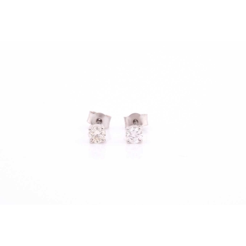 300 - A pair of platinum and diamond earrings, the round brilliant-cut diamonds of approximately 0.56 cara... 