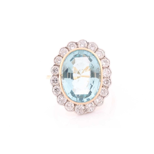 304 - An 18ct yellow gold, diamond, and aquamarine cocktail ring, set with a mixed oval-cut aquamarine of ... 