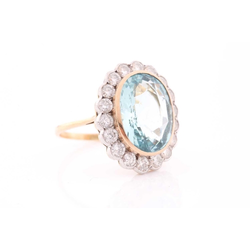 304 - An 18ct yellow gold, diamond, and aquamarine cocktail ring, set with a mixed oval-cut aquamarine of ... 