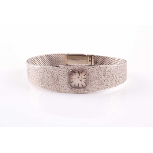 307 - An 18ct white gold ladies Omega cocktail watch, the small baton dial inset into an articulated strap... 