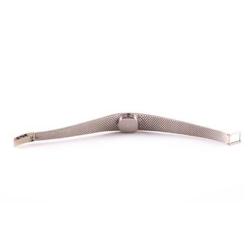 307 - An 18ct white gold ladies Omega cocktail watch, the small baton dial inset into an articulated strap... 
