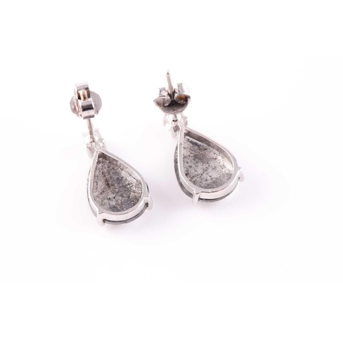 313 - A pair of diamond earrings, each set with a mixed pear-cut polki diamond, with salt and pepper inclu... 