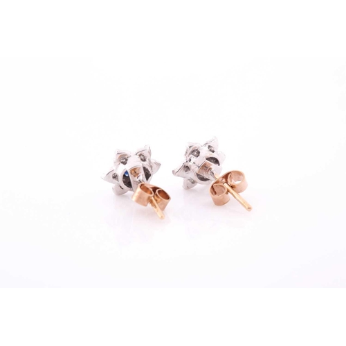 314 - A pair of diamond and sapphire floral cluster earrings, set in white metal mounts, the yellow metal ... 