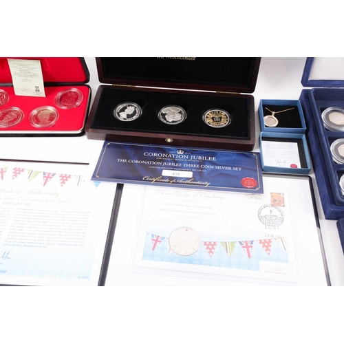 317 - Seven boxed commemorative coin sets, comprising: 1953 Coronation Sixpence in gold-plated diamond pen... 