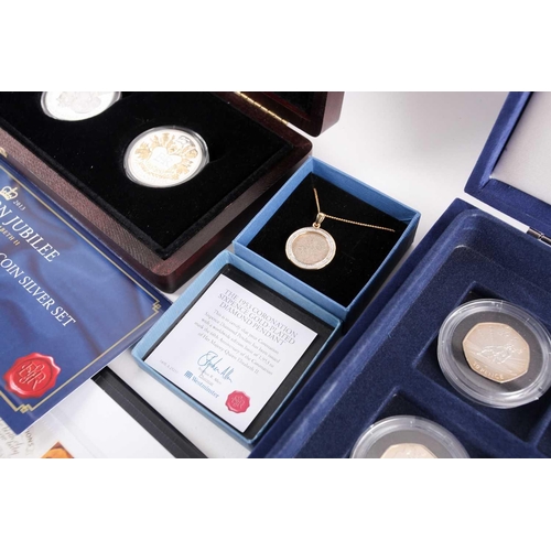 317 - Seven boxed commemorative coin sets, comprising: 1953 Coronation Sixpence in gold-plated diamond pen... 