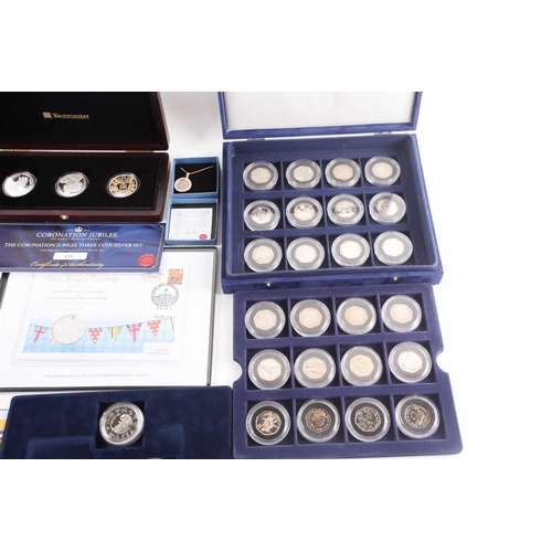 317 - Seven boxed commemorative coin sets, comprising: 1953 Coronation Sixpence in gold-plated diamond pen... 