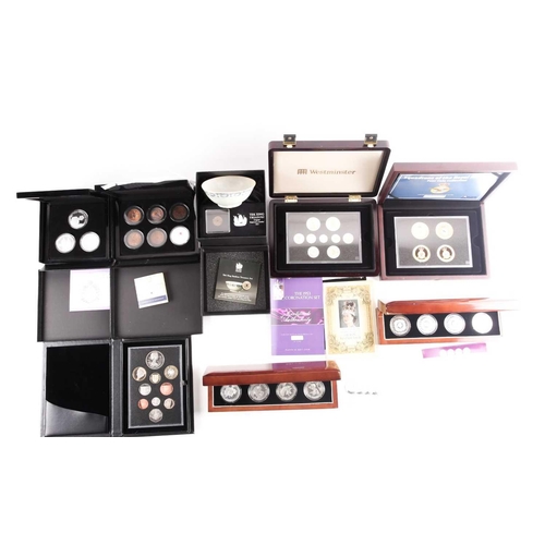 318 - Eight boxed sets of commemorative coins, comprising: 'Squadrons of the Royal Air Force' four-coin se... 