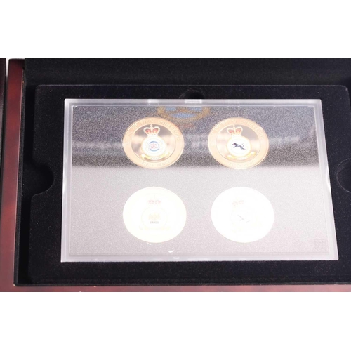 318 - Eight boxed sets of commemorative coins, comprising: 'Squadrons of the Royal Air Force' four-coin se... 
