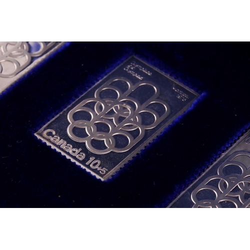 324 - A cased set of three silver ingots, designed as stamps, in honour of the 1976 Summer Olympics, relea... 