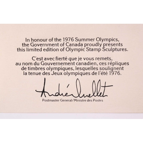 324 - A cased set of three silver ingots, designed as stamps, in honour of the 1976 Summer Olympics, relea... 