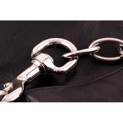 327 - Gucci. A black leather handbag, with chrome fittings and wide shoulder strap, paisley material lied ... 