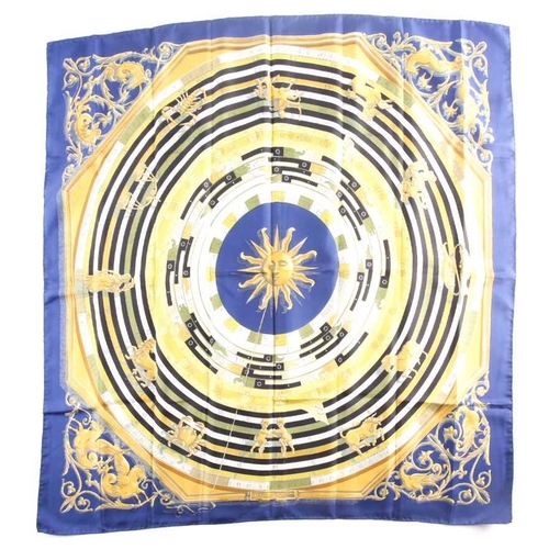 331 - Hermes, Paris. A polychrome zodiac scarf, with dark blue border, together with a Hermes scarf with t... 