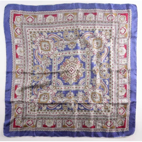 332 - A Liberty silk square scarf with peacock feathers on a black ground with a rust border, together wit... 