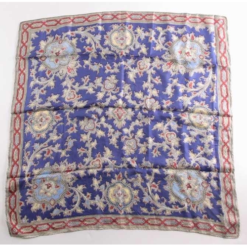 332 - A Liberty silk square scarf with peacock feathers on a black ground with a rust border, together wit... 