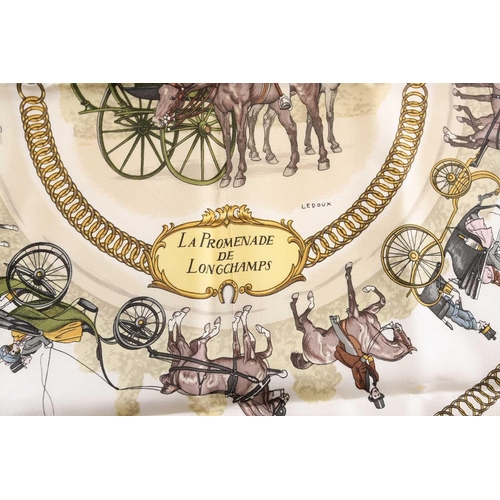 333 - A Hermes silk square scarf printed with La Promenade De Longchamps pattern in yellow and tones of pa... 