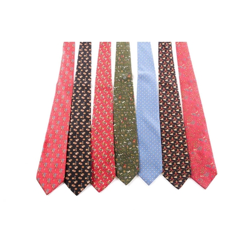 341 - A group of seven Ferrogamo silk ties, various designs, in blue, red, green, and black silk. (7)