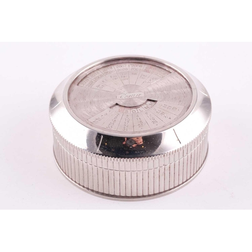 345 - A Cartier chrome desk calender, with adjustable year, month, and date dial to lid, 8 cm diameter, 3.... 