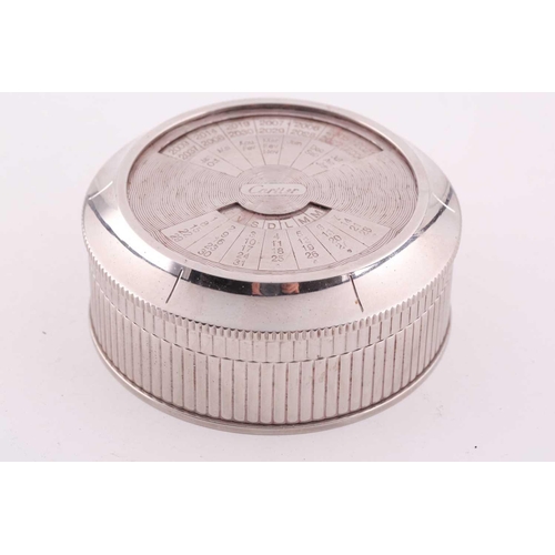 345 - A Cartier chrome desk calender, with adjustable year, month, and date dial to lid, 8 cm diameter, 3.... 