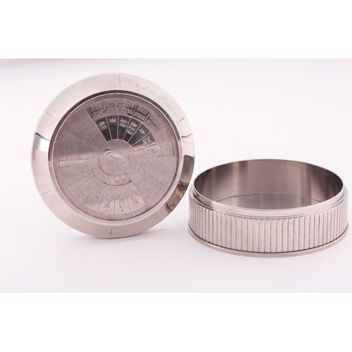345 - A Cartier chrome desk calender, with adjustable year, month, and date dial to lid, 8 cm diameter, 3.... 
