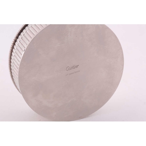 345 - A Cartier chrome desk calender, with adjustable year, month, and date dial to lid, 8 cm diameter, 3.... 