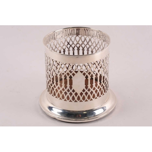 348 - A silver bottle holder. London 1908 by Mappin and Webb. Cylindrical with pierced sides and turned wo... 