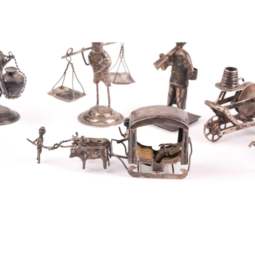 350 - A Continental novelty silver grinding wheel on barrow, and other novelty items in white metal and a ... 