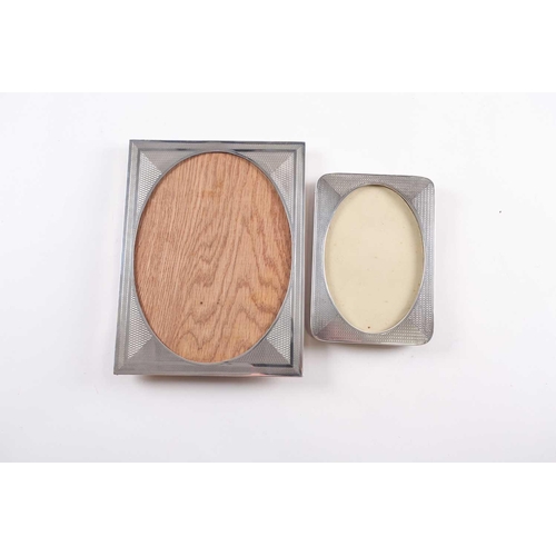 351 - An Art Deco photograph frame, Birmingham 1927 by F H Adams Ltd, rectangular, engine-turned with oval... 