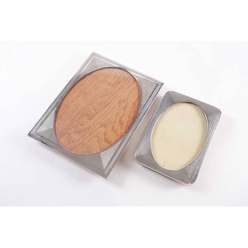 351 - An Art Deco photograph frame, Birmingham 1927 by F H Adams Ltd, rectangular, engine-turned with oval... 