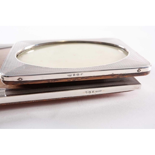 351 - An Art Deco photograph frame, Birmingham 1927 by F H Adams Ltd, rectangular, engine-turned with oval... 