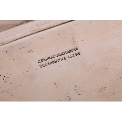 352 - A George V silver salver, London 1920 by Z Barraclough & Sons, of shaped, square form on four scroll... 