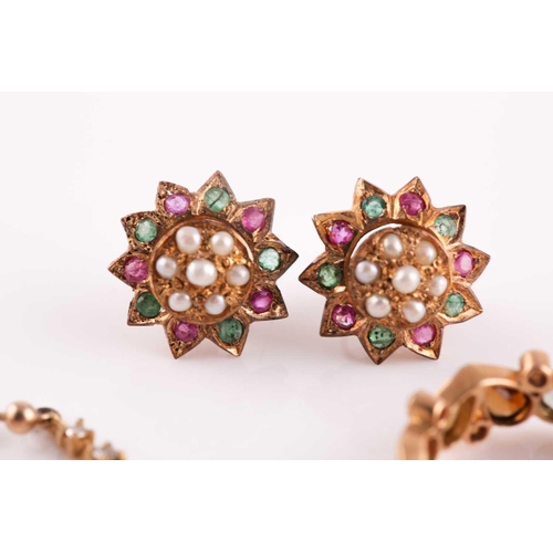 63 - A yellow metal, tourmaline, and diamond eternity ring, set with mixed pear-cut multi-coloured tourma... 