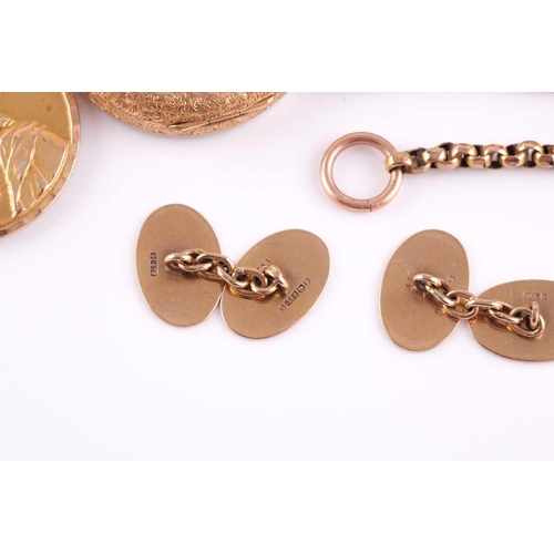 65 - A yellow metal pendant depicting the Virgin Mary with the Infant Jesus, depicting Jesus as an adult ... 