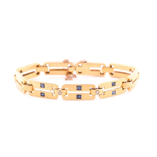66 - A yellow metal, diamond and sapphire bracelet, comprised of articulated bar links, the three cenral ... 