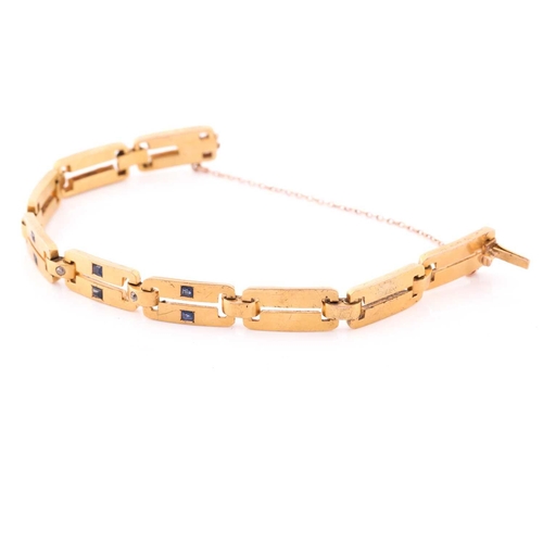 66 - A yellow metal, diamond and sapphire bracelet, comprised of articulated bar links, the three cenral ... 