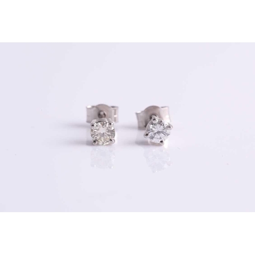 70 - A pair of round brilliant-cut diamond ear studs, the diamonds of approximately 0.34 carats combined.