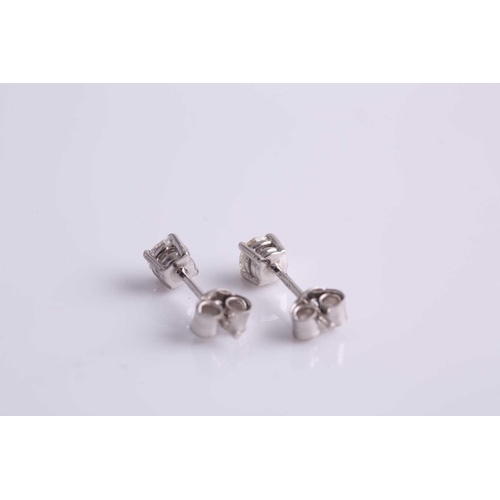 70 - A pair of round brilliant-cut diamond ear studs, the diamonds of approximately 0.34 carats combined.