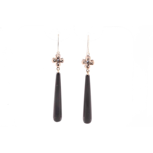 71 - A pair of diamond and onyx drop earrings, with tapered black onyx drops, beneath a diamond and sapph... 